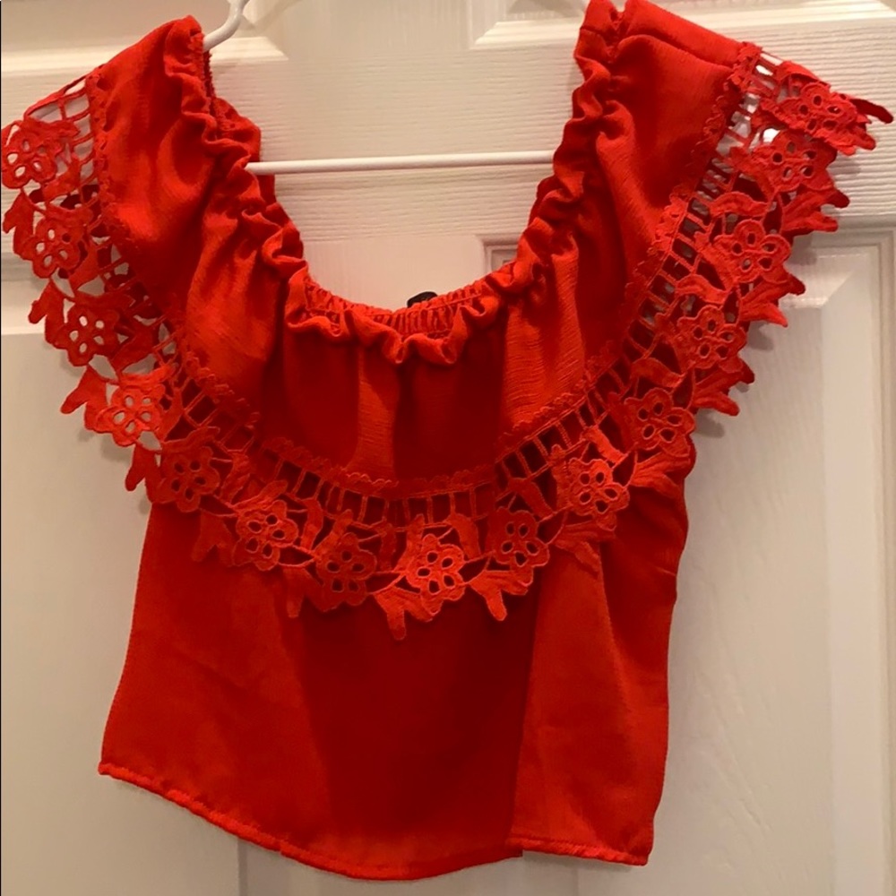 Red off the shoulder blouse.